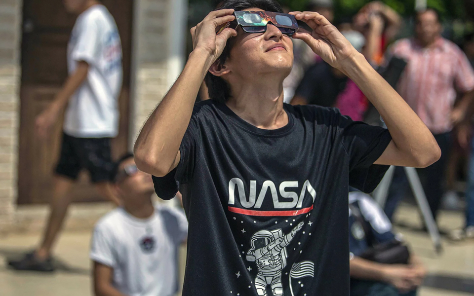 A man watches the solar eclipse in Merida, Mexico in 2023.